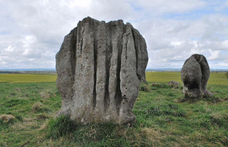 Duddo Standing Stones by David Clay. A close-up of two impressively wind-sculpted standing stones.